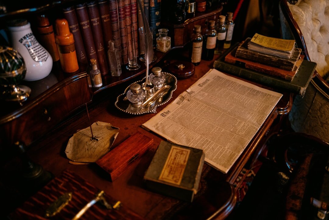 Wooden desk with a will document, fountain pen and reading glasses