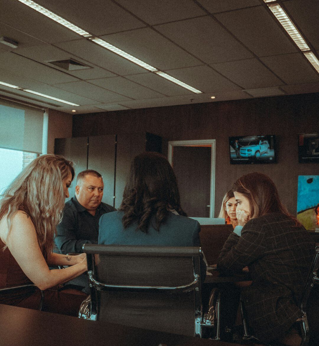 Legal consultant meeting with a client across a desk