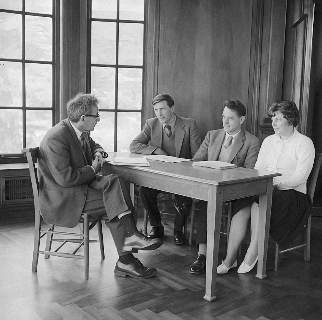 Turkish family signing legal documents together at a table