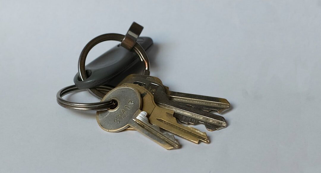 House keys resting on top of a property deed document